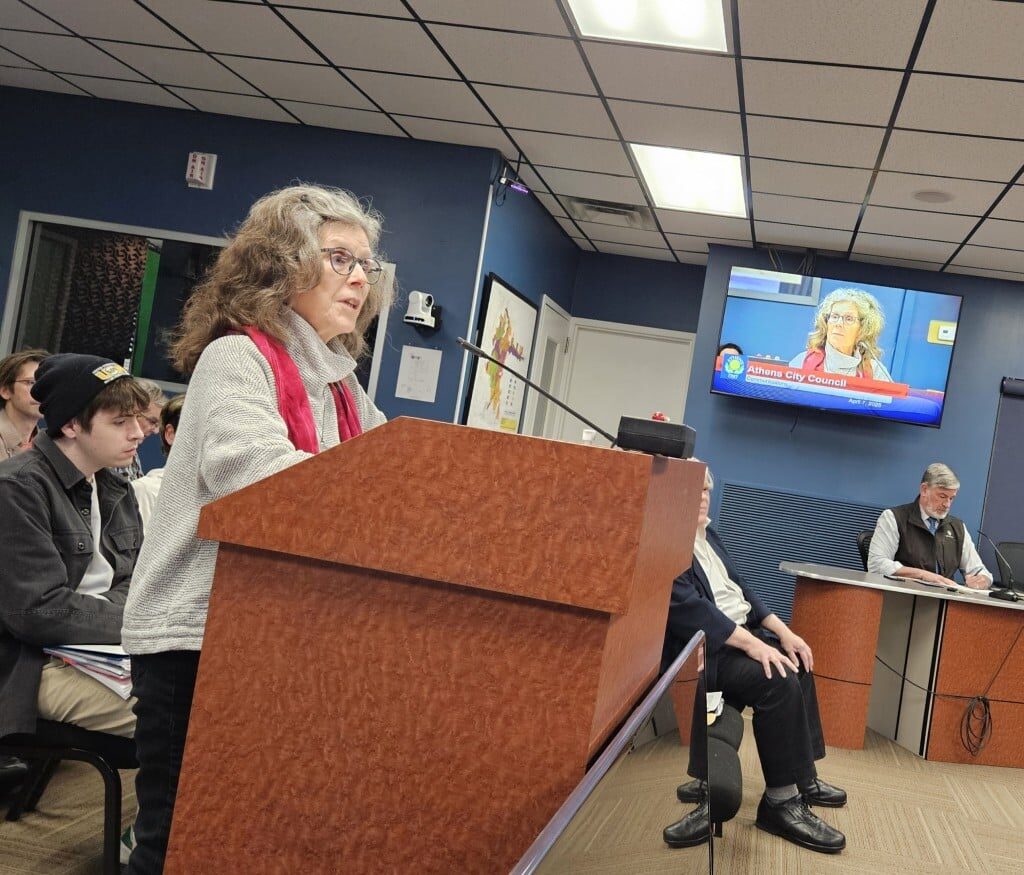 Woman standing behind a podium. 