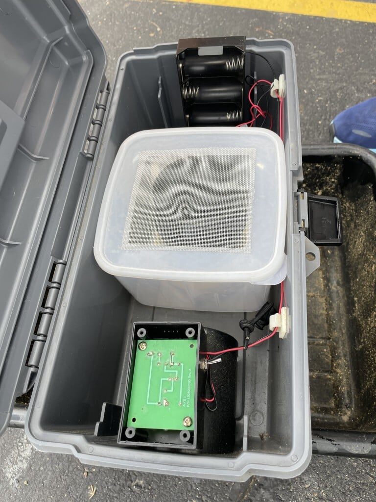 A picture of a green mosquito trap contraption.