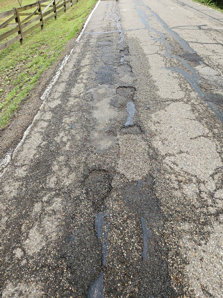 A road with potholes.