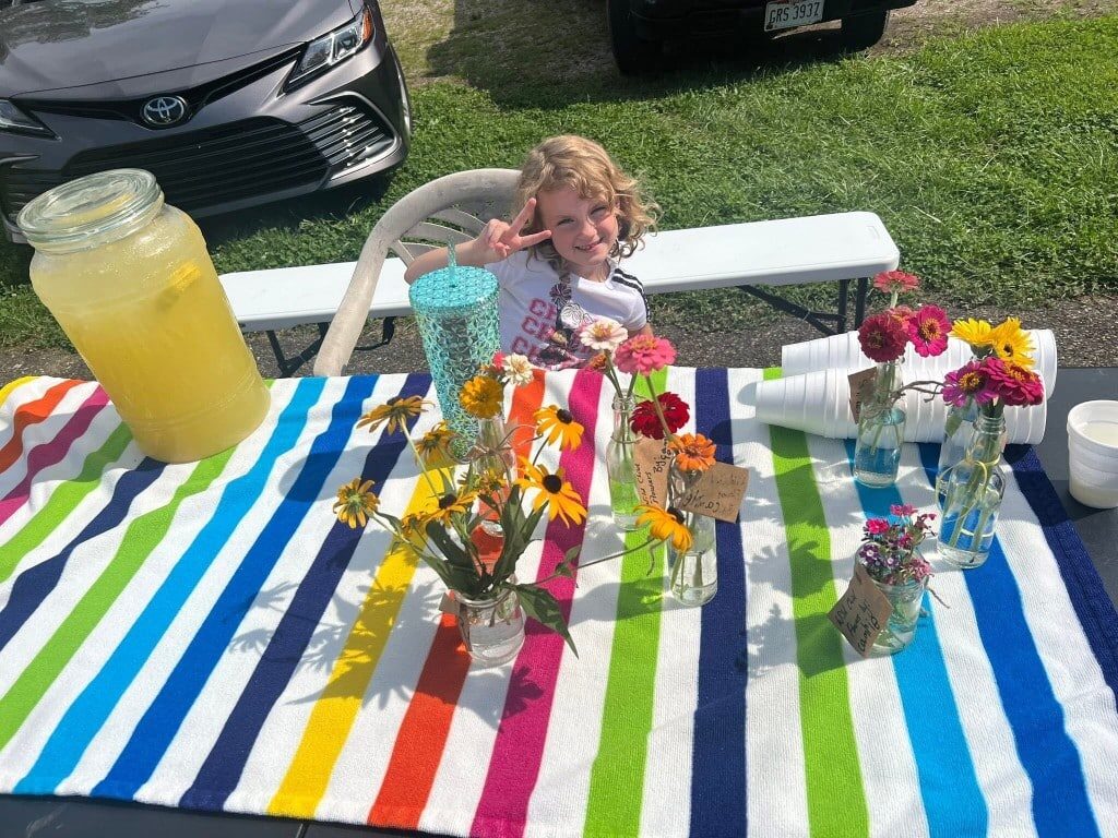 Little girl making a peace sign