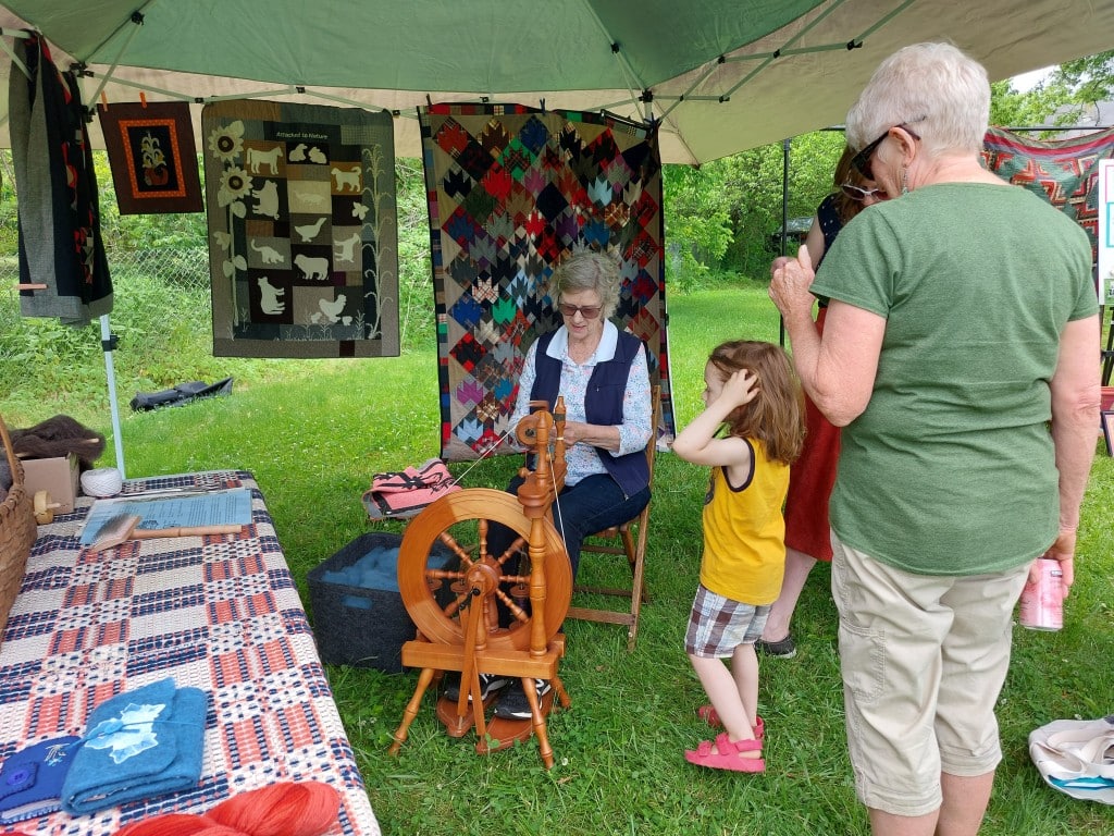 A woman spinning wool.
