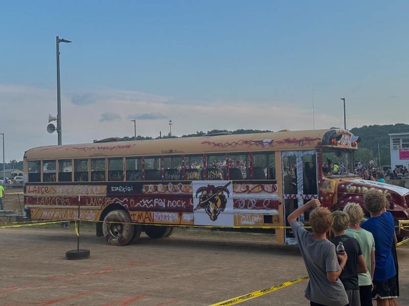 A spray-painted school bus featuring the mascot of the Federal Hocking Local Schools District, the Lancers.