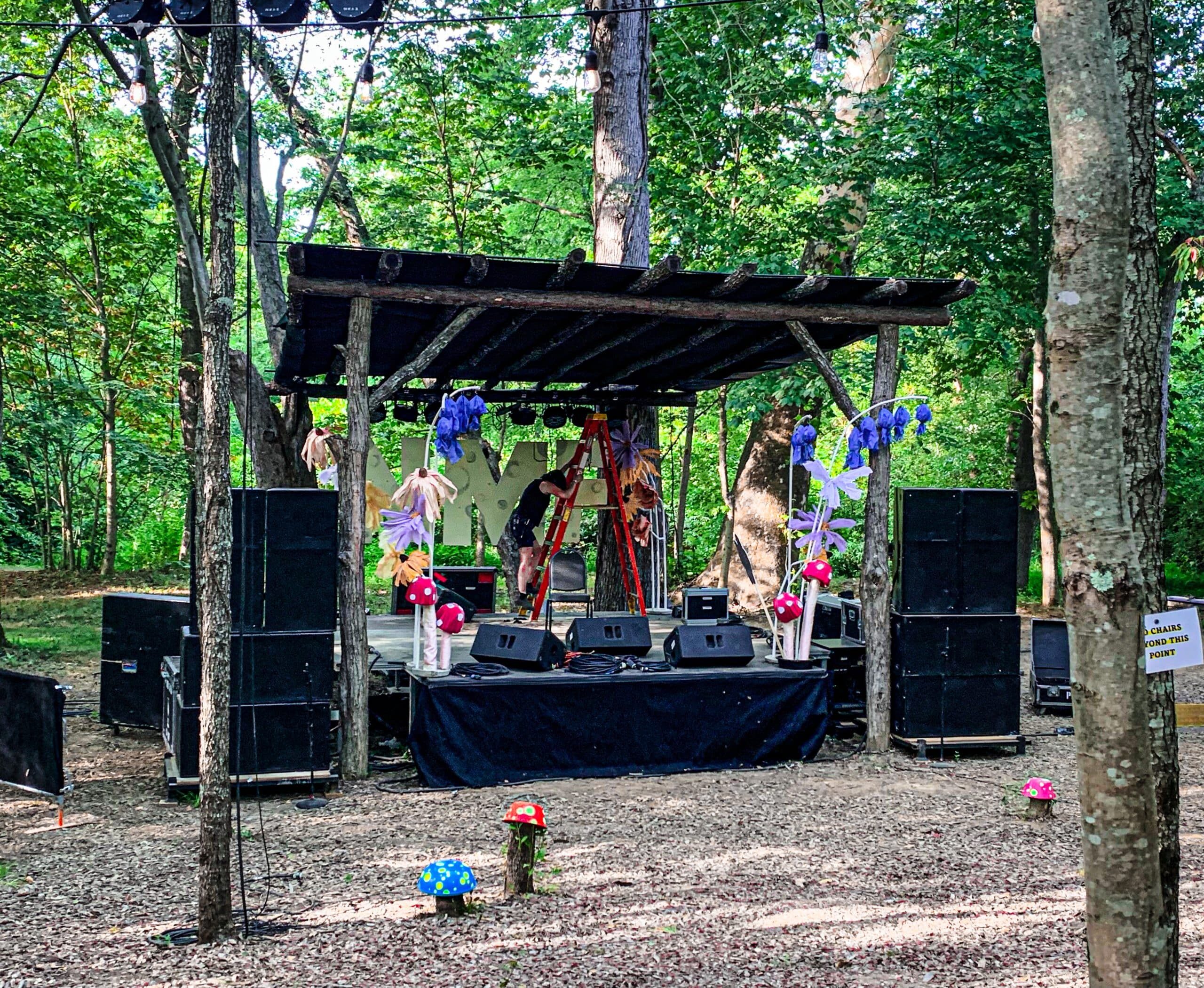 people standing next to a sign that says "NMF"