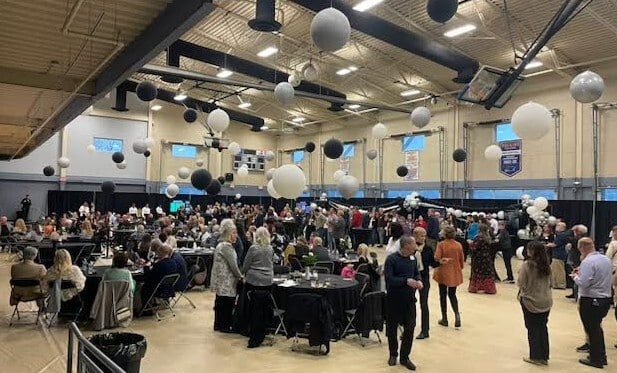 Room full of people at a fundraiser event