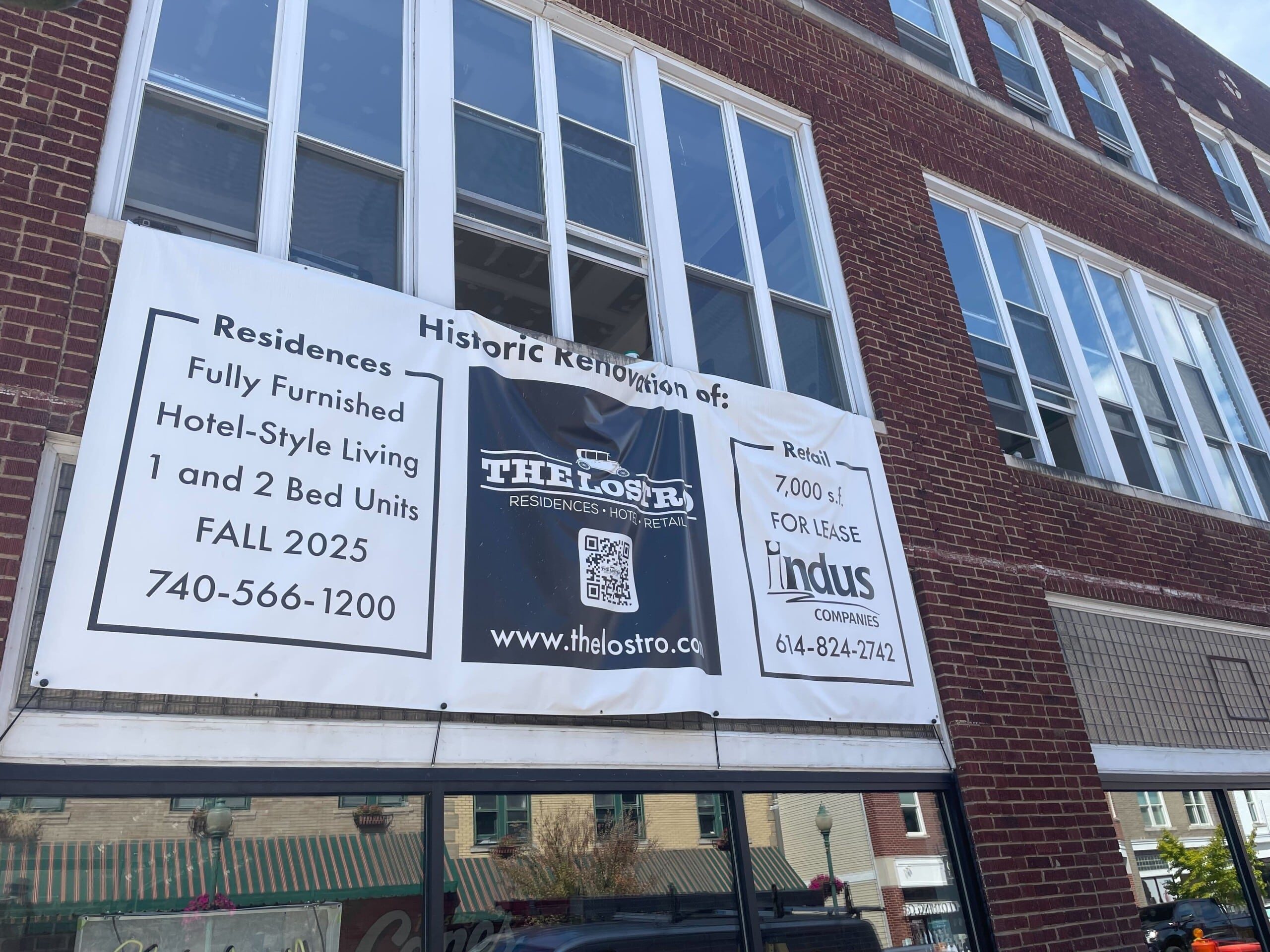 Banner hanging at the Lostro Project property in Uptown Athens.