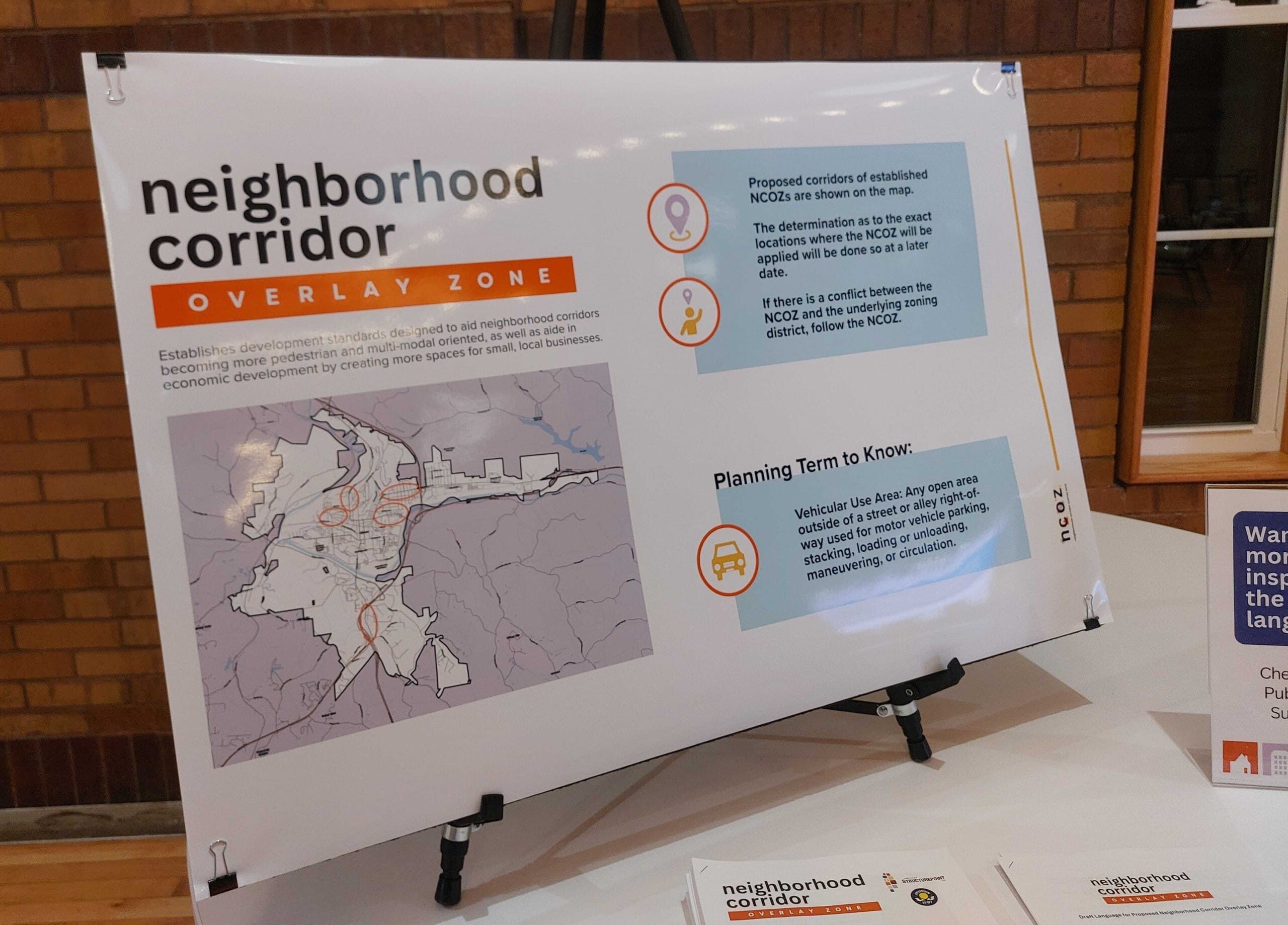 A photo of a poster board at a public meeting.