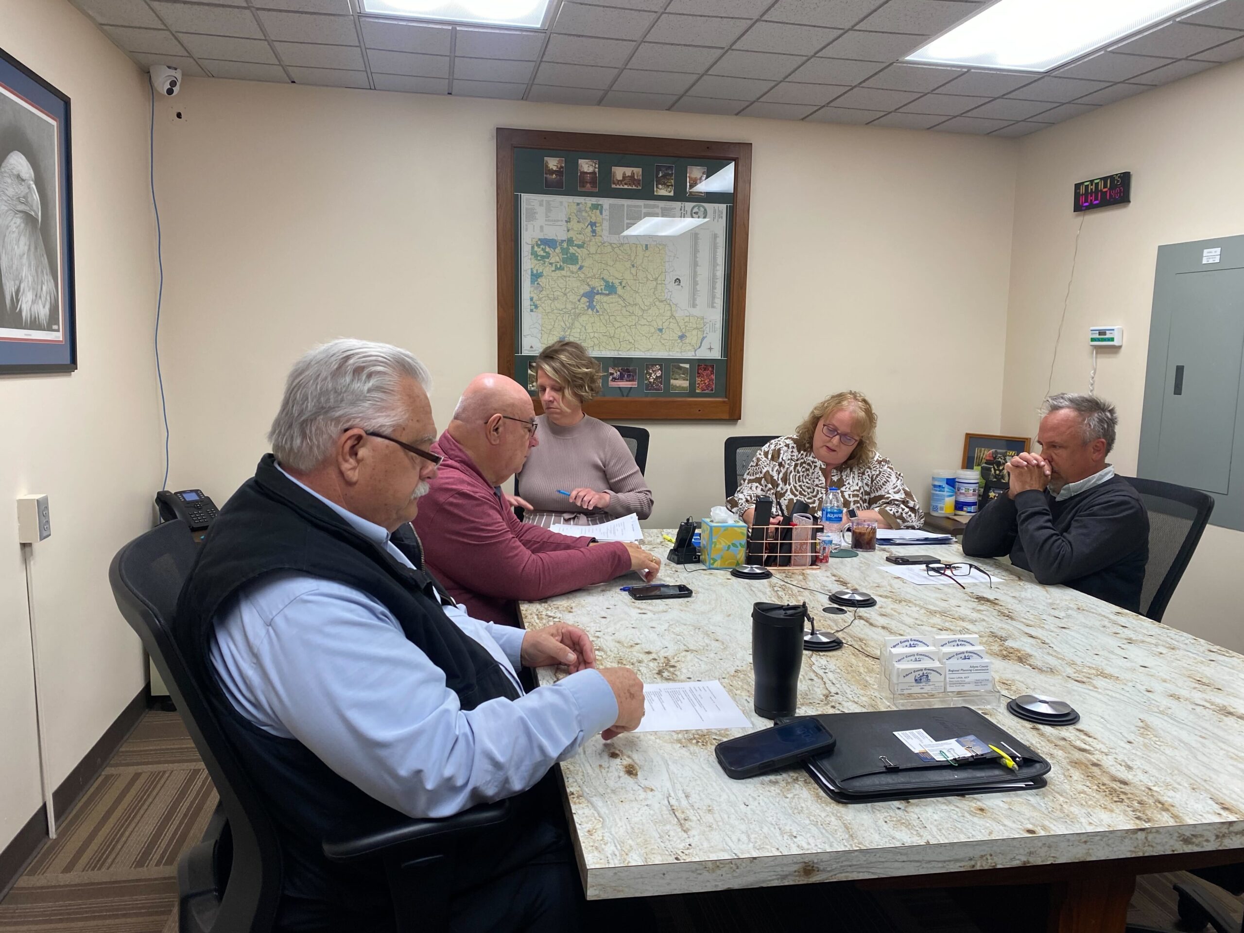 Athens County Commissioners meet around a table