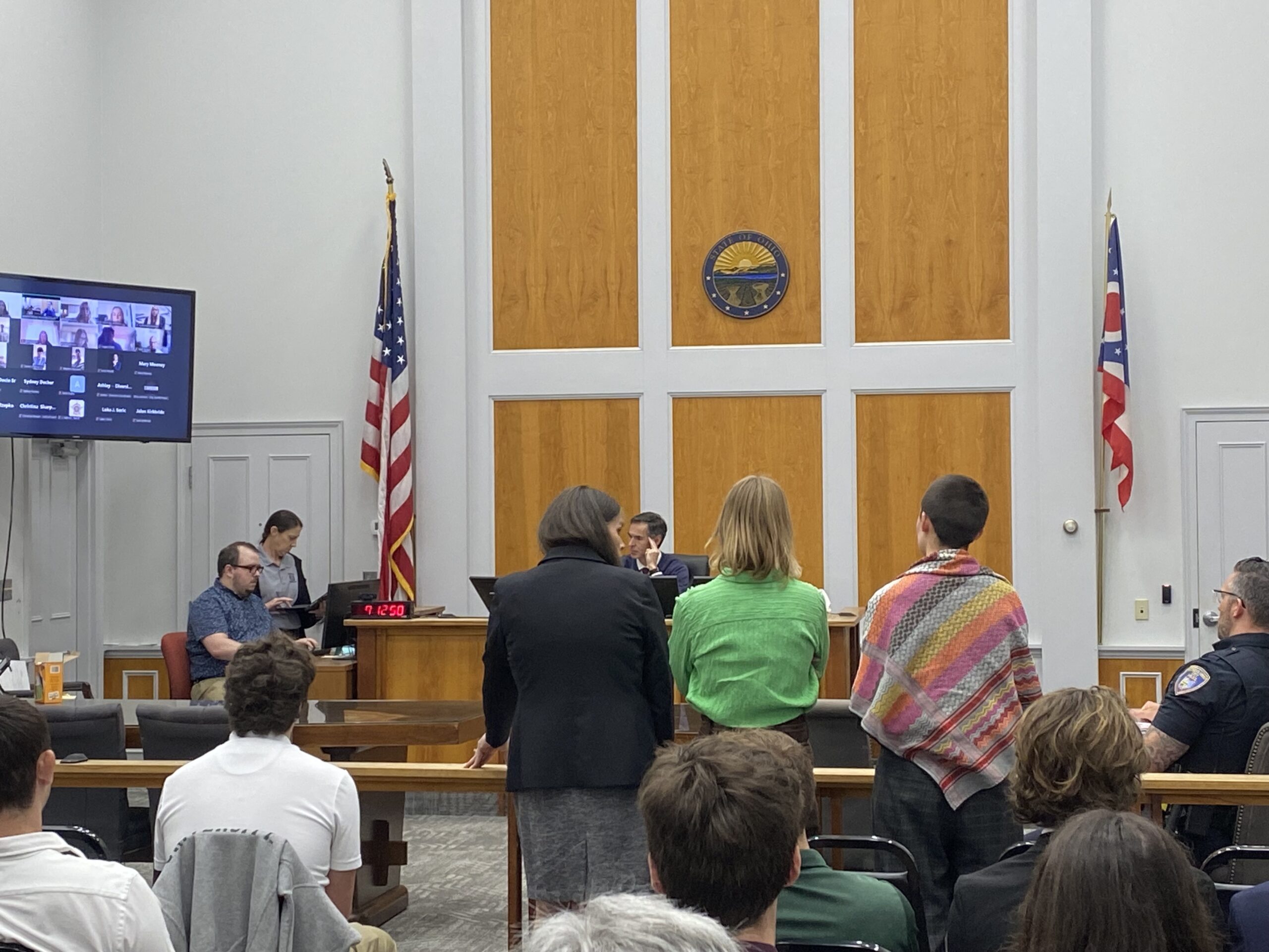 Center for Student Legal Services Managing Attorney Kimberlee Francis stands with two students arrested at an OU protest during their April 23, 2026, arraignment before Athens County Municipal Court Judge Todd Grace.