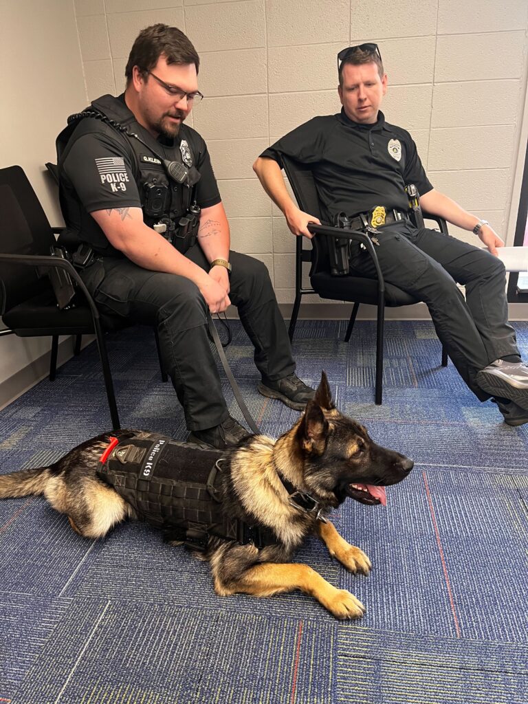 Police officers and dog