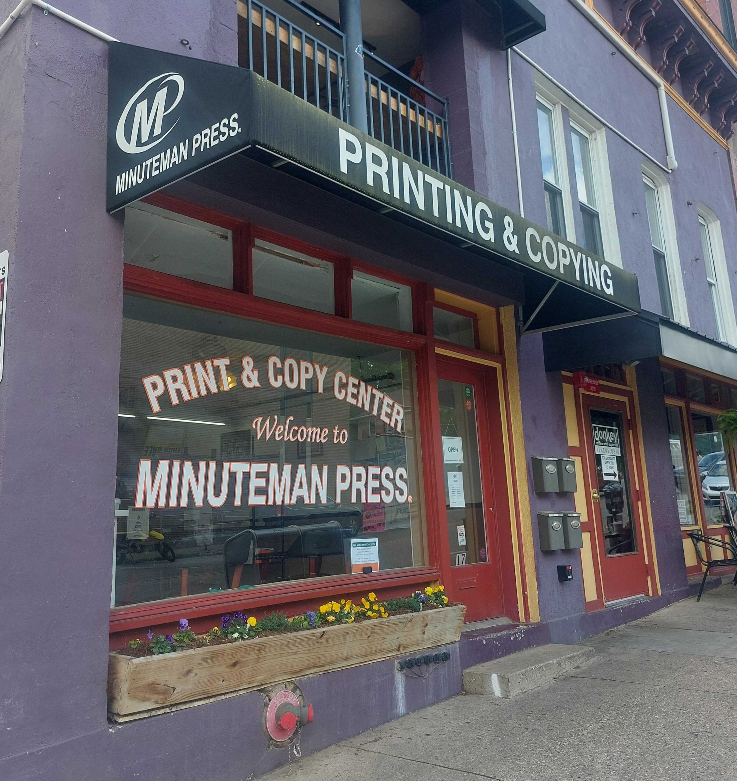 A photo of Minuteman Press of Athens storefront.