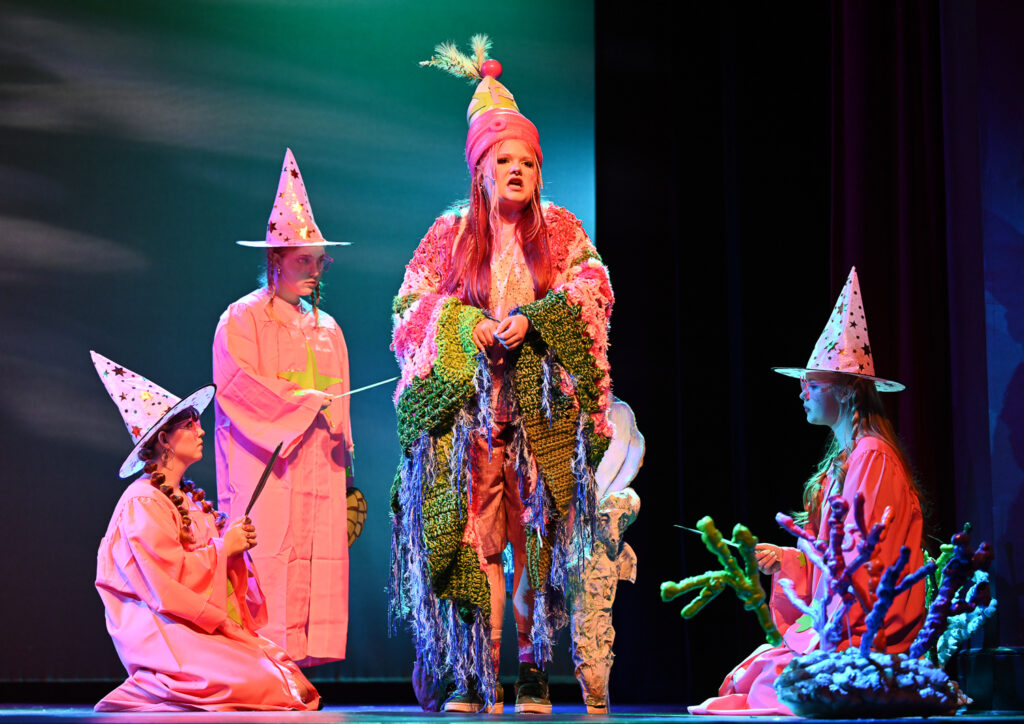 Patrick Star played by Julianna Manley surrounded by their adoring sardines.