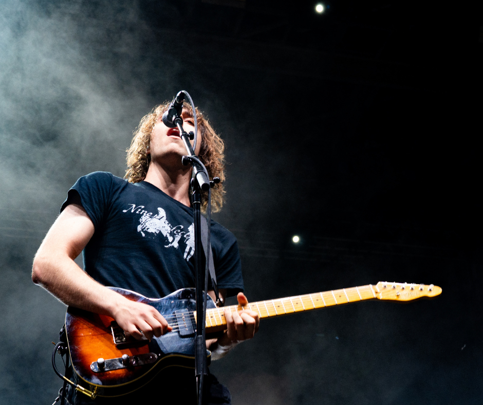 Cameron Winter playing guitar and singing.