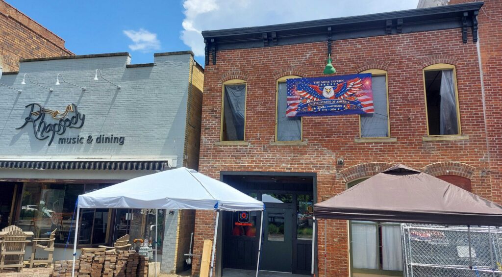 The Mine Tavern as seen from the street with new bricks on the right side of the building.