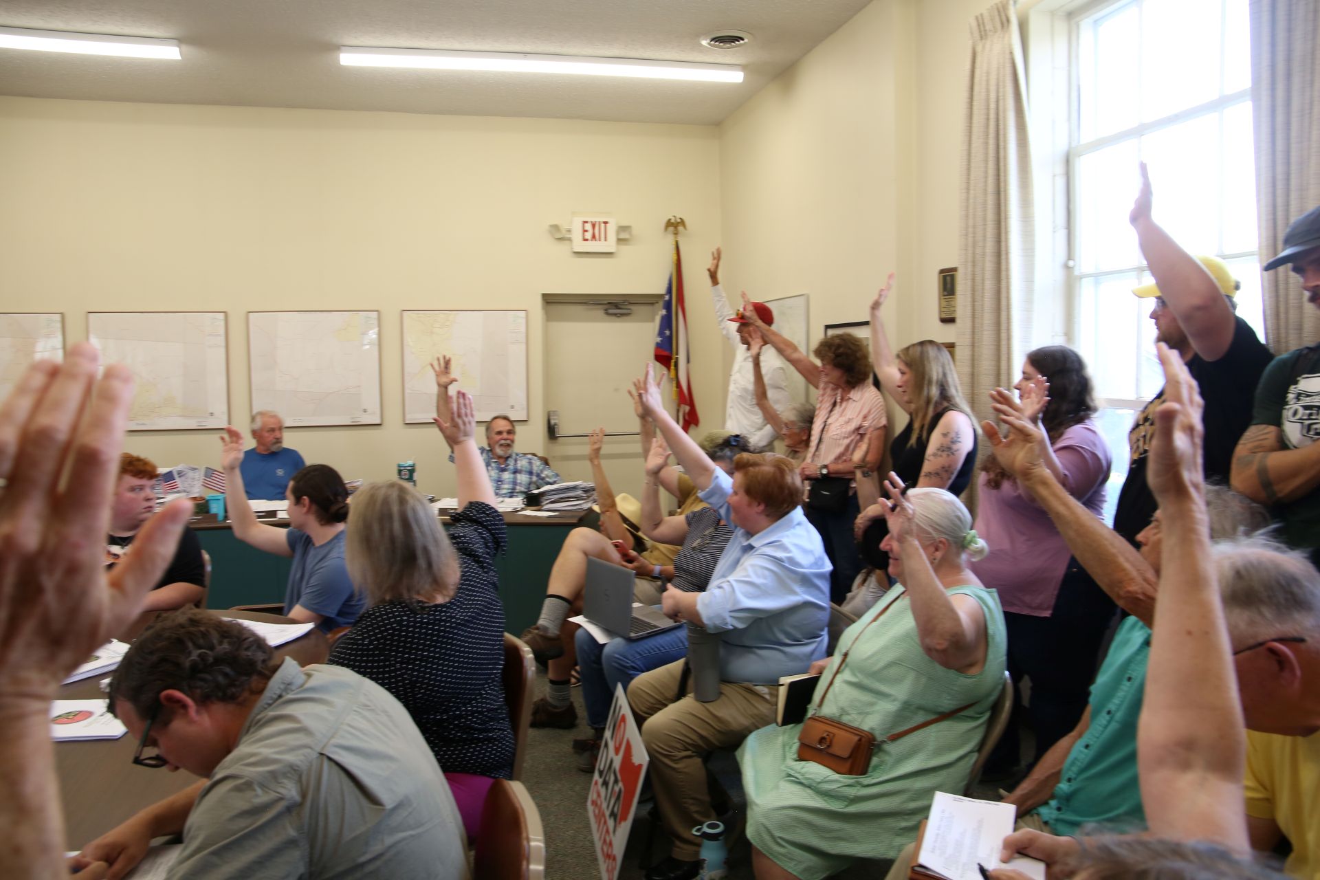 A crowd with raised hands
