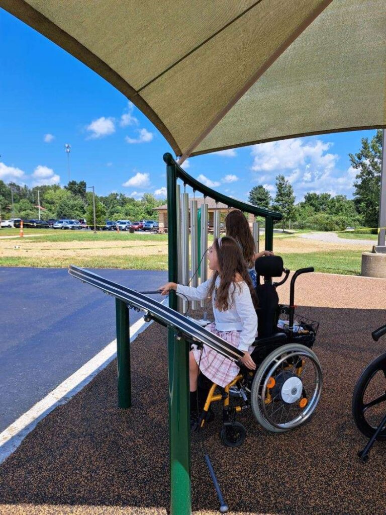 Child in wheelchair on playground
