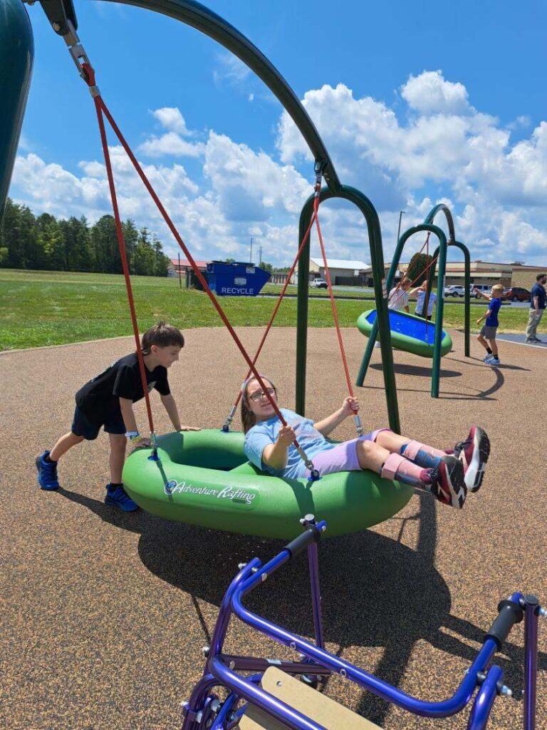 Children playing on adaptive playground