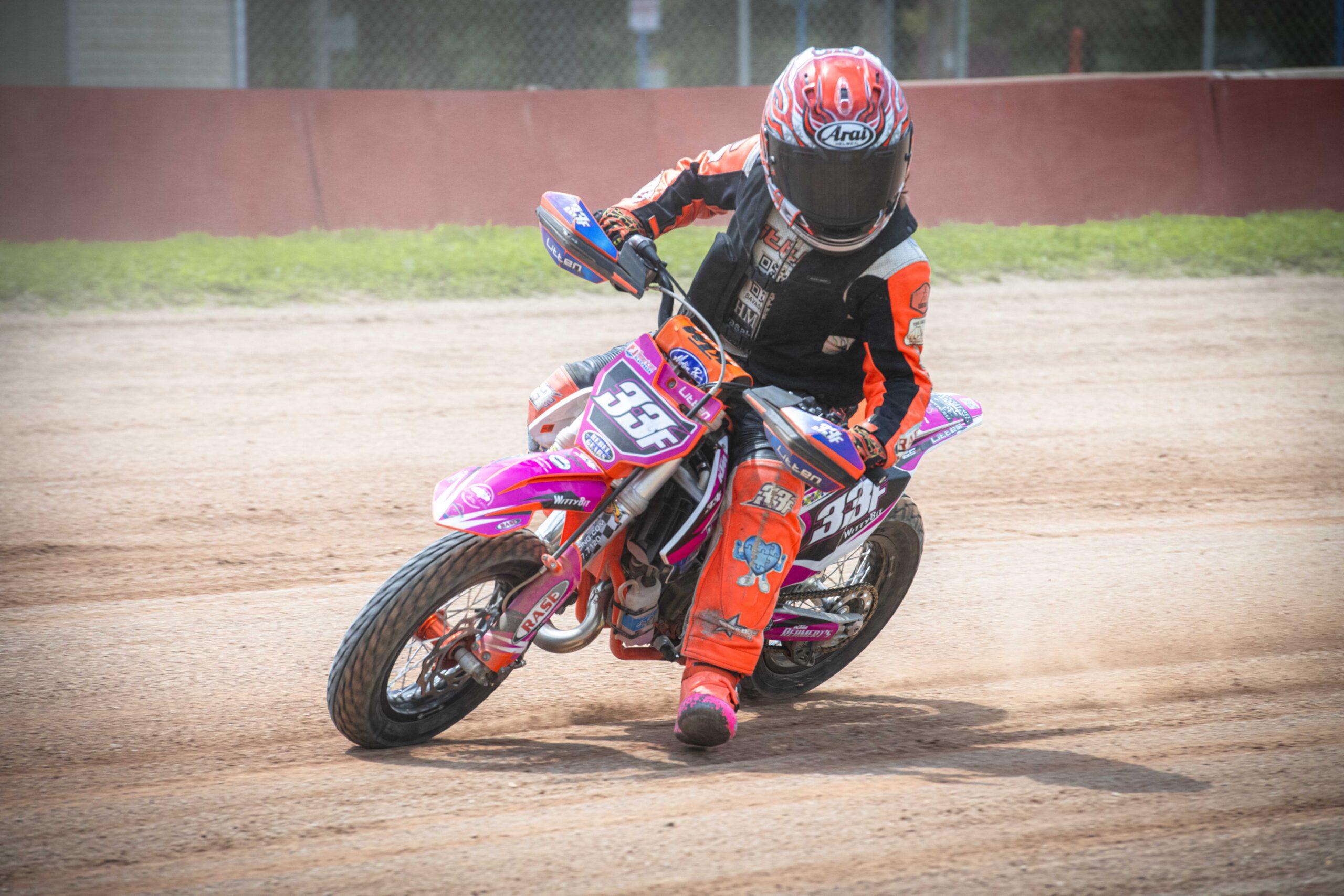 Sierra Litten leans in on turn two years old during her race. The lowercase ‘f’ on her number plate tells other riders that she is based in Ohio.