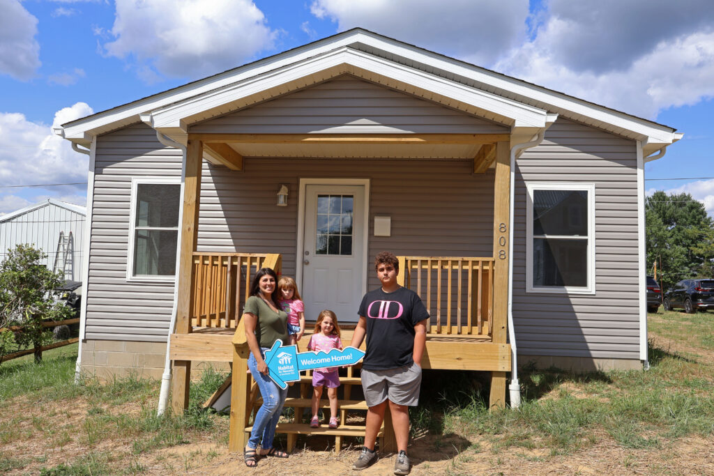 Family in front of a house