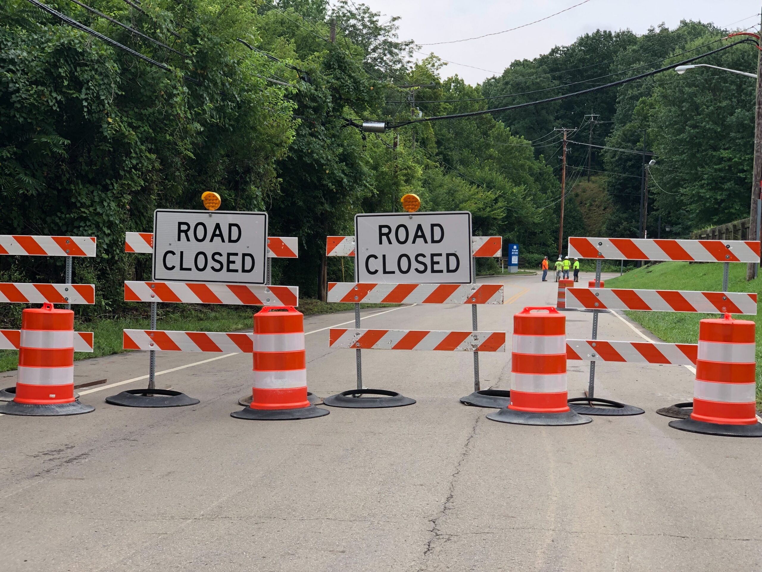 Construction signs reading 'road closed'