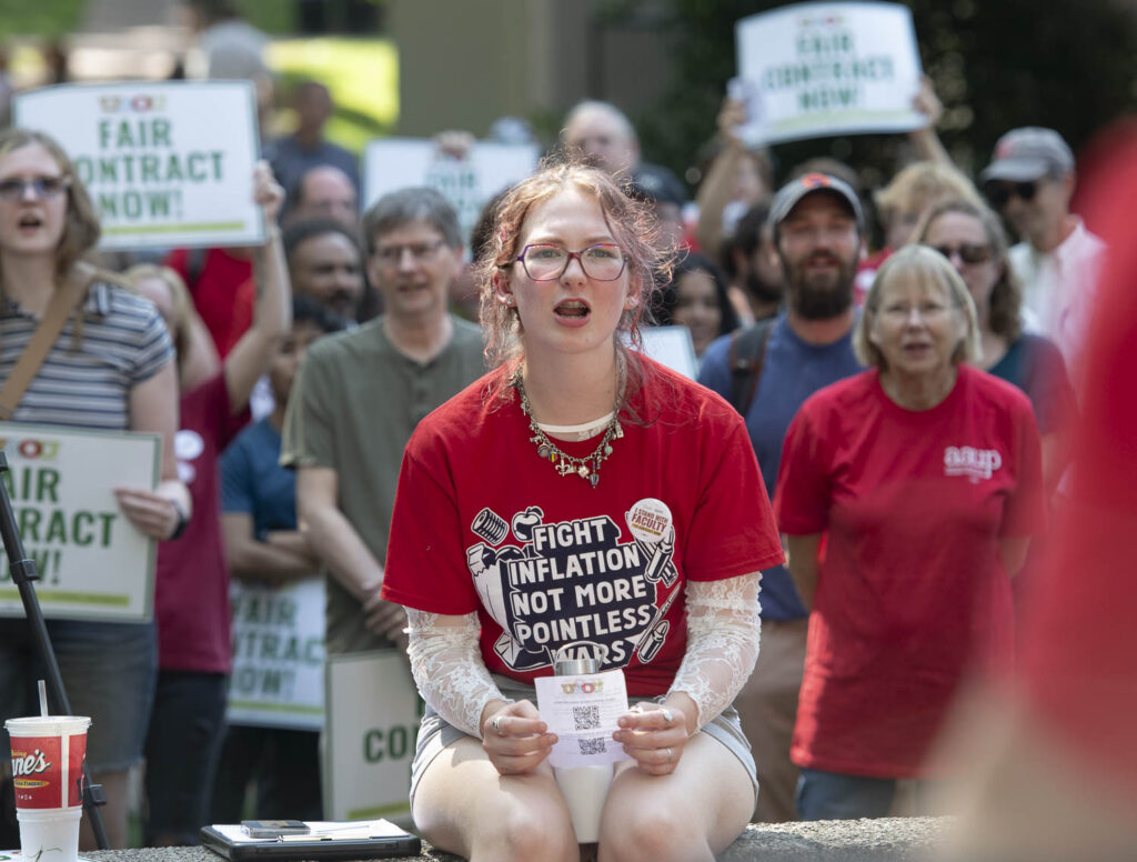 Person sitting in red t-shirt