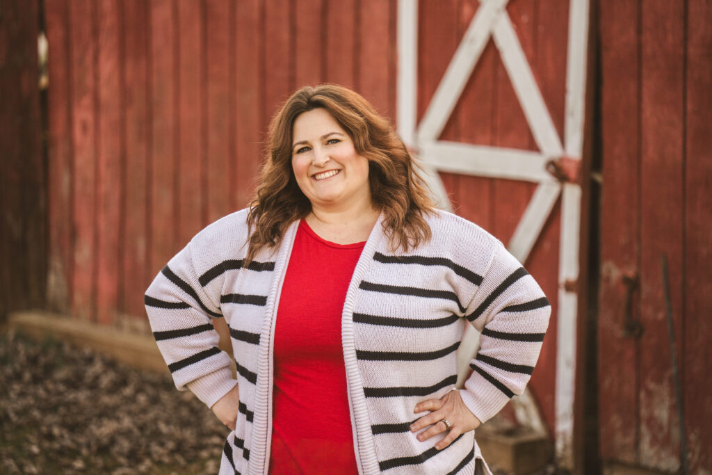Woman smiling with hands on hips