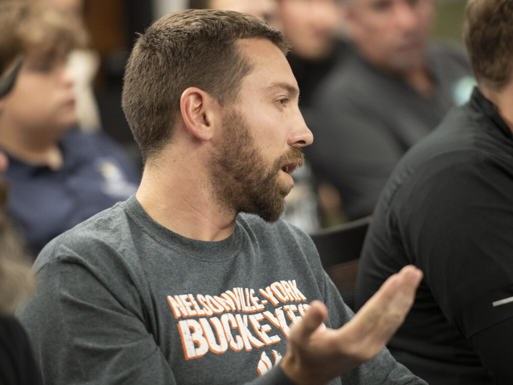 Casey Cox speaks, wearing a Nelsonville-York Buckeyes shirt.