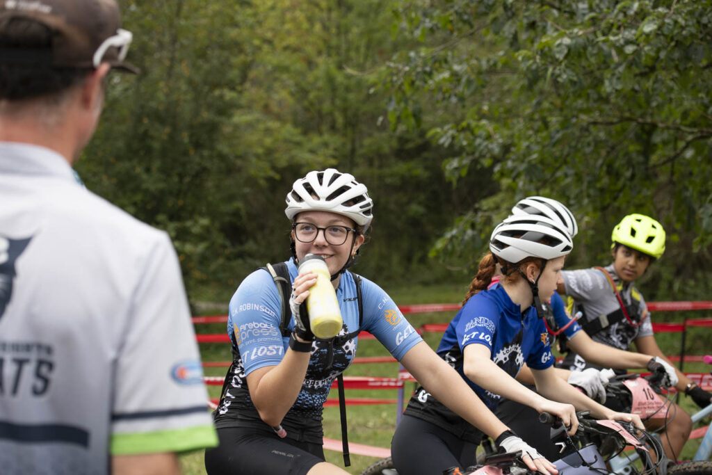 Young person on bike with water bottle