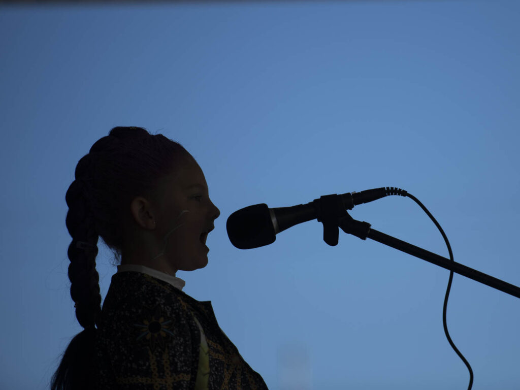 Girl singing into microphone
